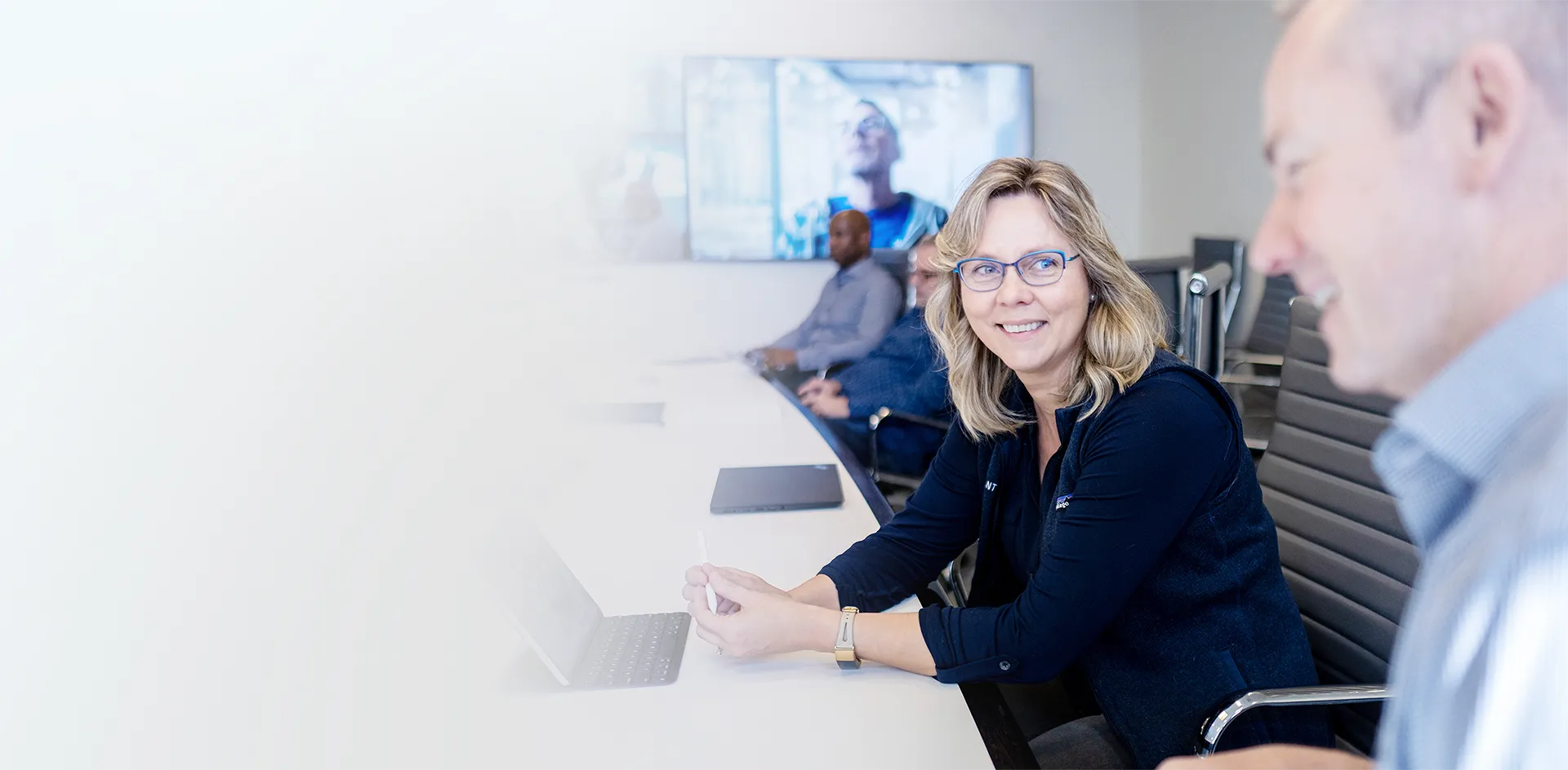 Team members in a conference room during a meeting