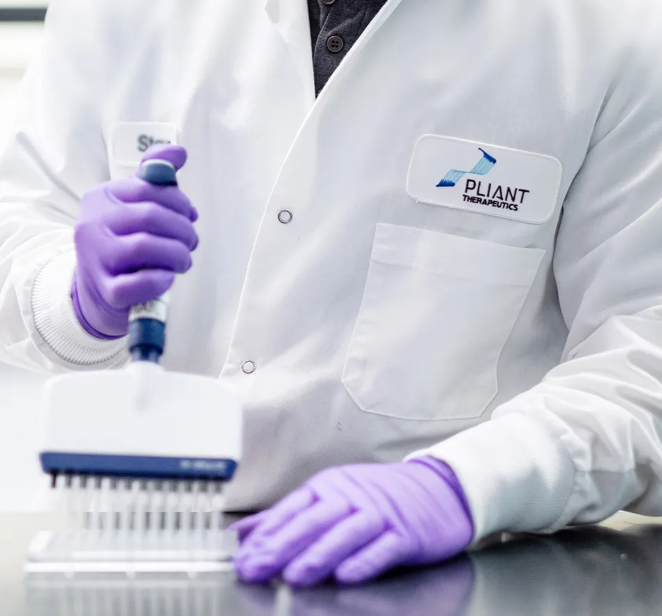 Scientist using a pipette in a laboratory